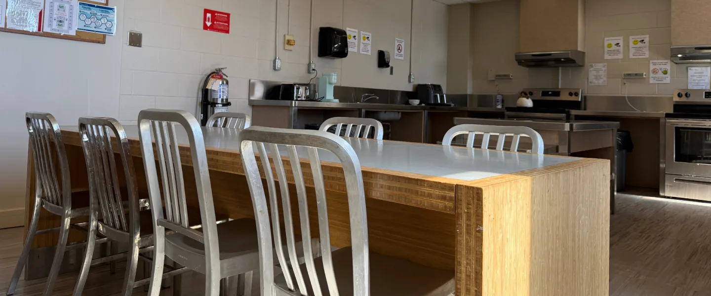 A kitchen with a seating area