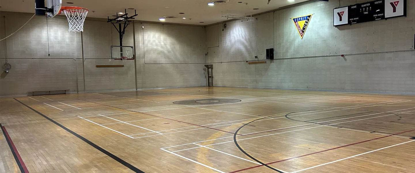 Taggart Family Y gymnasium with basketball hoop.