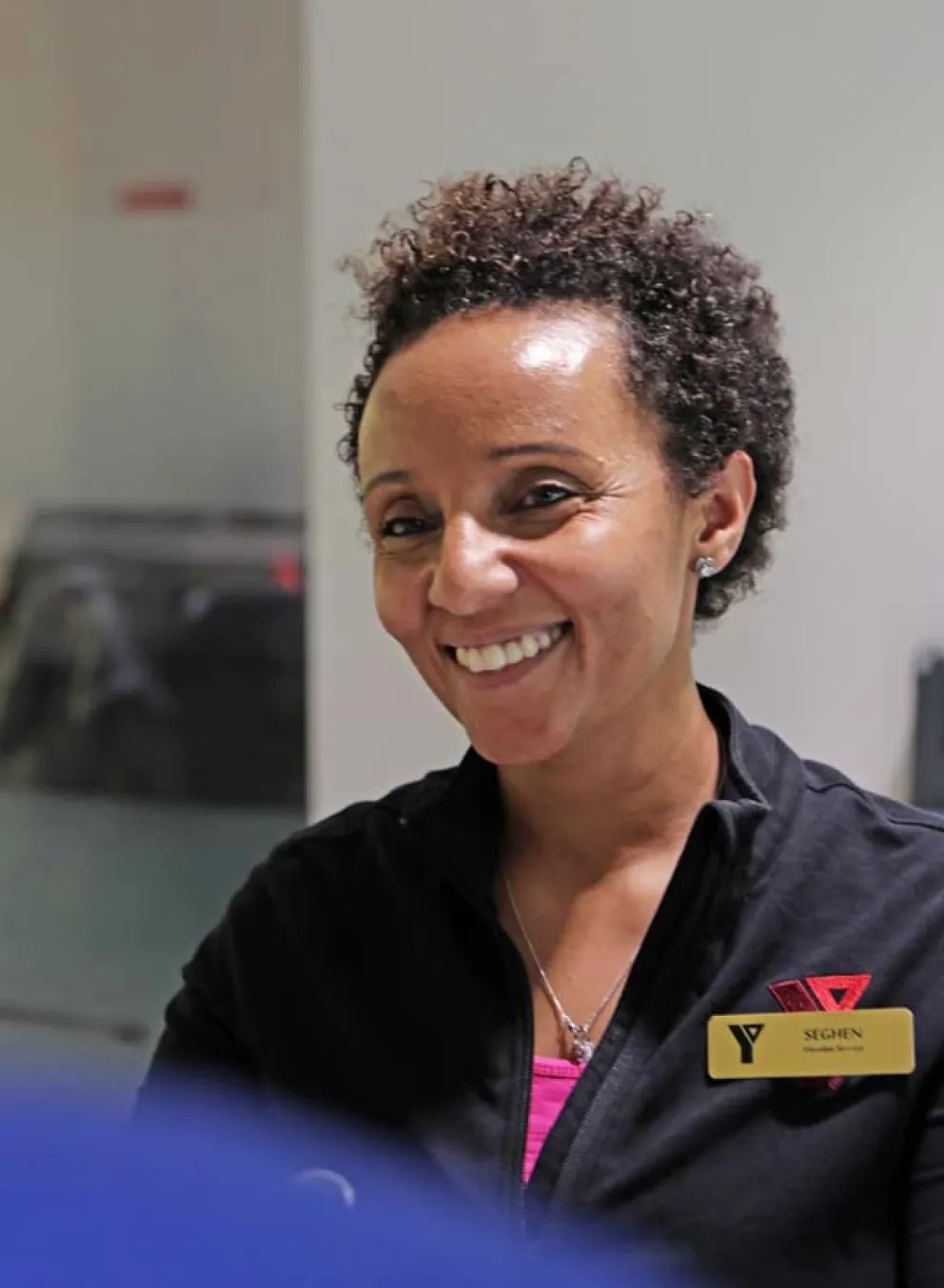 Y staff helping a client.