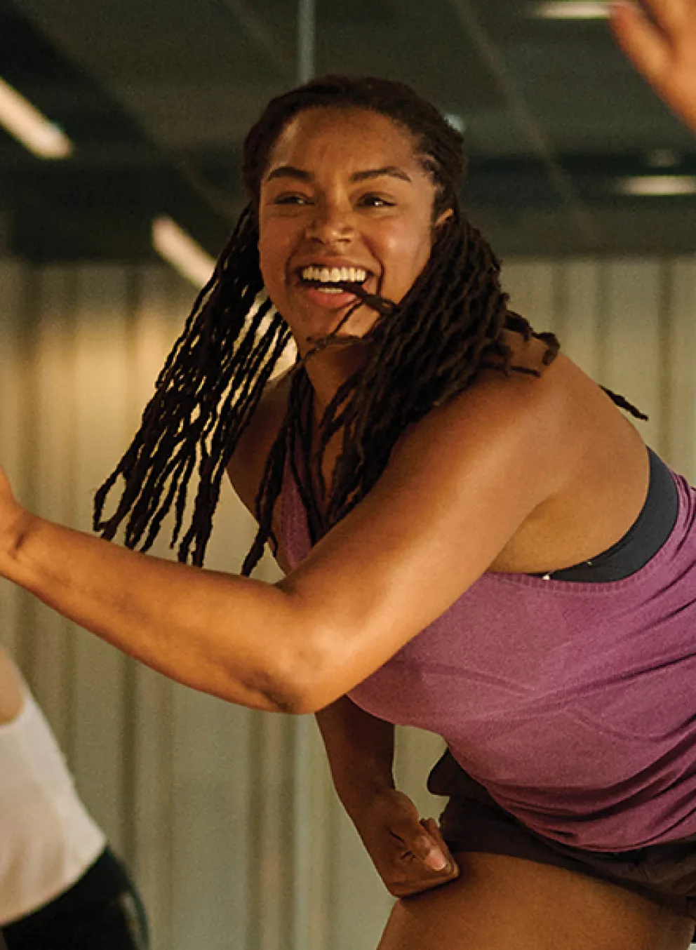 Several women engaged in a dance class, demonstrating different movements and enjoying the rhythm together.