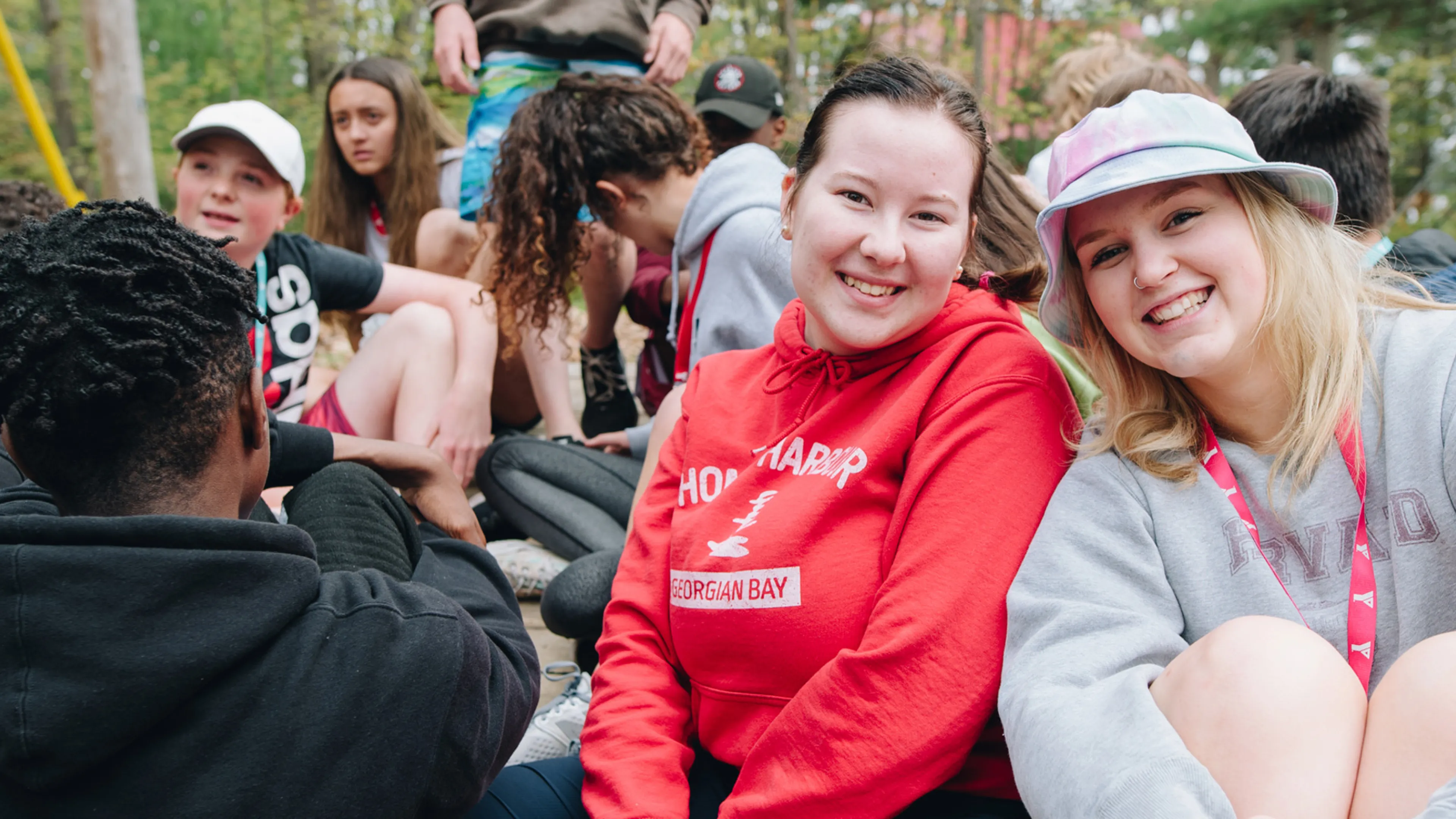 Two smiling camp councilors having fun.