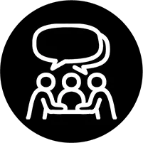 Icon of people sitting around a table with a speech bubble above them.
